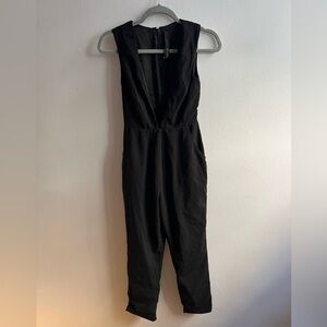Black jumpsuit with deep plunge neckline XS